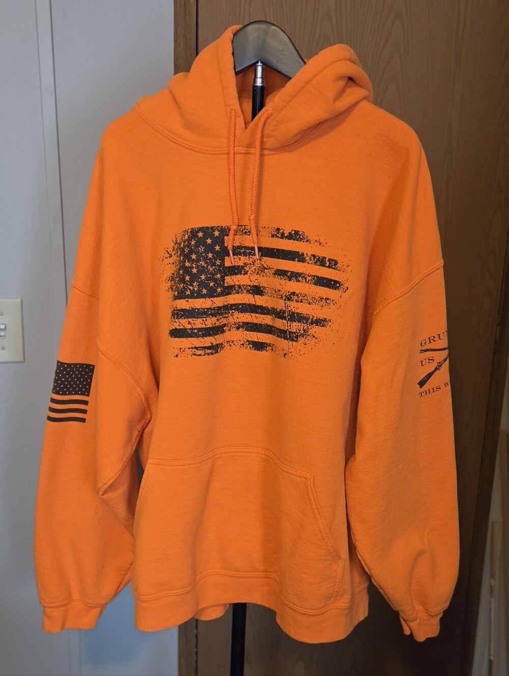 Grunt Style Orange Hoodie with Distressed Black Flag Print